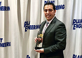 Alex Nino holding 2018 SDT LUBExpert Plant Engineering Product of the Year award