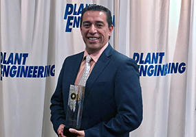 Alex Nino holding SDT LEAKChecker product of the year award